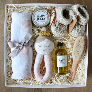 New baby girl gift set with organic and natural high quality newborn essentials and adorable hand knitted booties