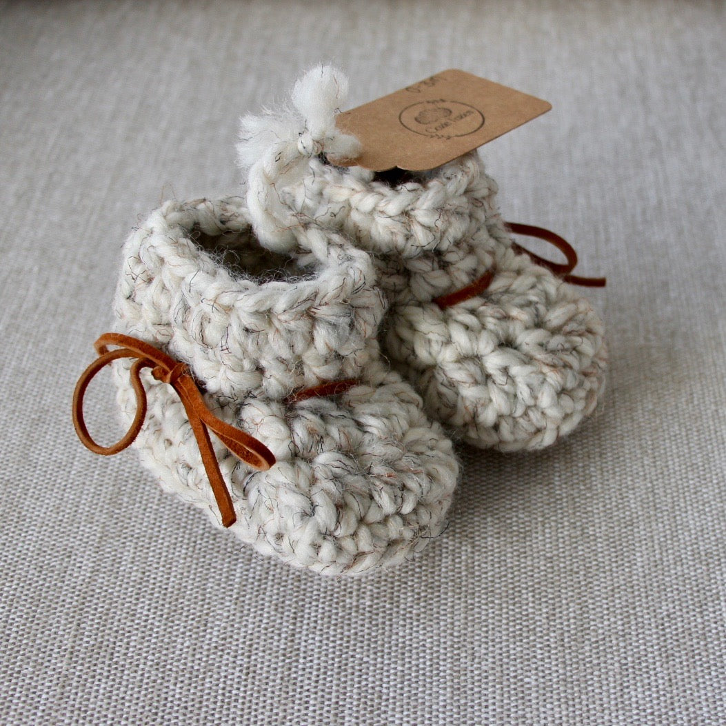 Adorable hand knitted baby booties by Cozie Tozies