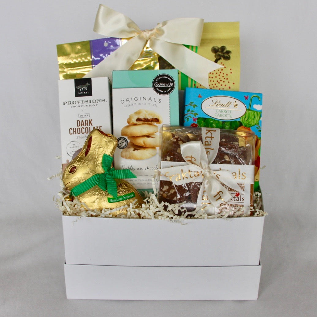 Easter Gift basket filled to the brim with the most delectable chocolates and cookies along with organic, fair trade coffee roasted locally in Toronto by Wyld Coffee Co.