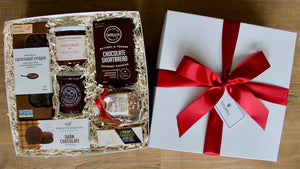 A delightful fall inspired gourmet gift box by Perfect Baskets is filled with decadent sweet shortbreads, chocolates and artisan crackers and brie cheese, paired with a gourmet jar of cranberry sauce - perfect to share at their Holiday dinner!