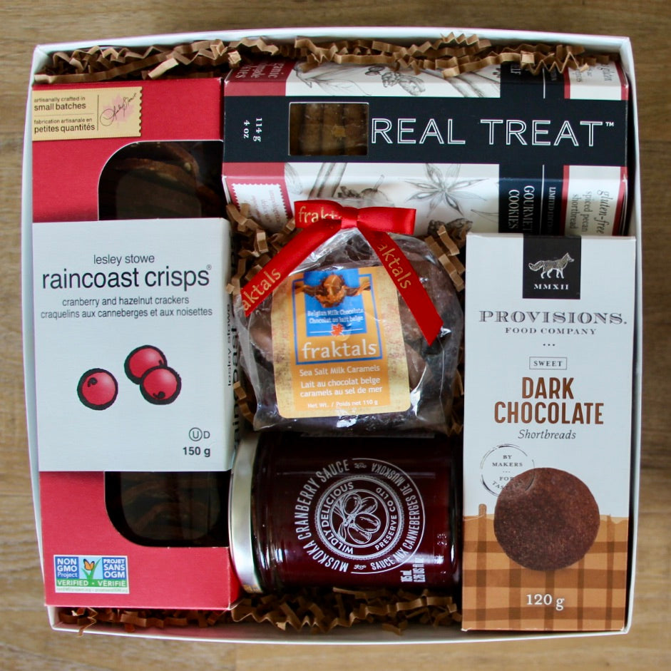 A delightful gift box by Perfect Baskets is filled with decadent shortbreads, chocolates and artisan crackers paired with a gourmet jar of cranberry sauce - perfect to share at their Holiday dinner! The perfect little corporate Holiday gift for employees and clients.