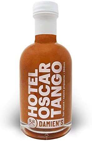 Damien's Hotel Oscar Tango Hot Sauce is a habanero-and-mango blend that contains no salt or added sugar. Just a straight-up clean heat with a garlicky finish.  Crafted from mango, vinegar, habaneros, garlic & fresh herbs.  Made in Toronto.