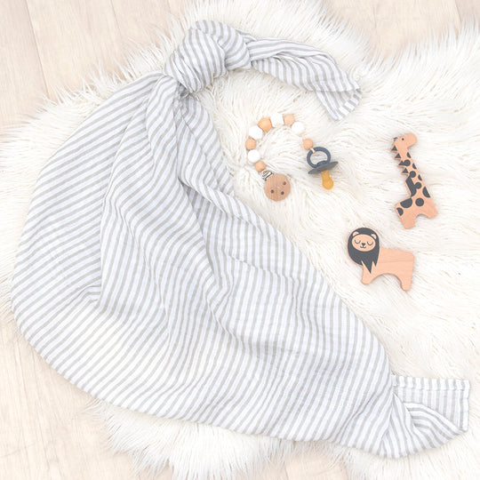 This Grey Stripe muslin blanket is timeless and long-lasting. Made of 100% premium cotton, our blankets are incredibly soft, lightweight and breathable. 